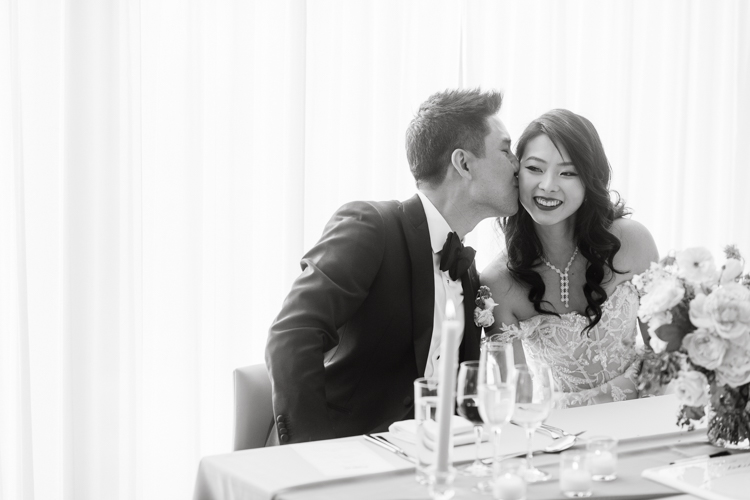 Public Hotel NYC spring rooftop wedding with Stella and Peter. NYC began to loosen COVID restrictions so events and weddings were finally allowed. Stella and Peter were able to keep their original wedding date, but unfortunately Stella's parents couldn't make it to the wedding due to COVID travel restrictions. Stella and Peter's wedding took place on 17th floor with rooftop access at the Public Hotel. Their wedding ceremony was on the rooftop, as well as their first look and some photos then we wandered around the hotel and took some epic photos at the pent house and escalator. Public Hotel NYC was so fun to photograph and I had the coolest, the most chill couple to work with. Stella and Peter's epic wedding at Public Hotel NYC photographed by Karis | Hey Karis.